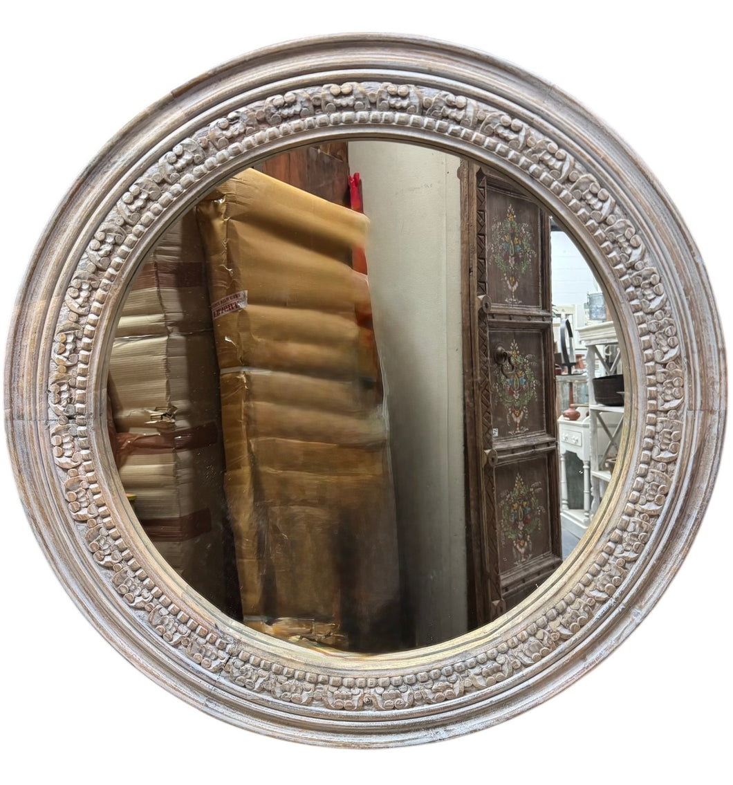 Carved round mirror