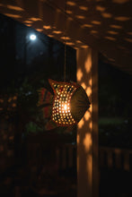 Hanging fish candle holder
